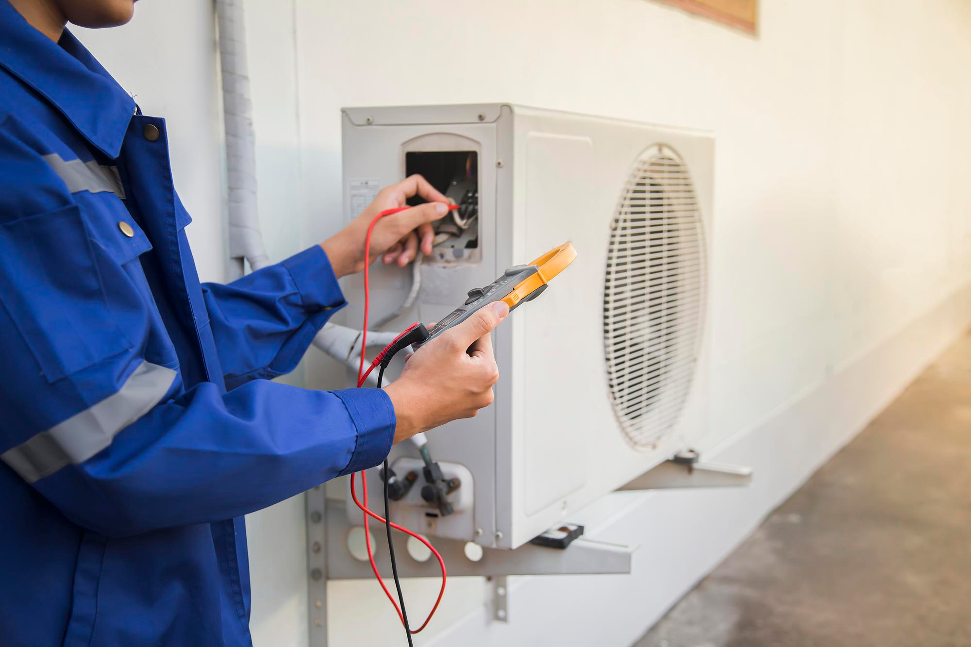 technician-checking-operation-air-conditioner